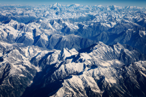 Aerial view of Swat Valley with Tirich Mir in the distance – showcasing the majestic mountains of Central Asia in Northern Pakistan