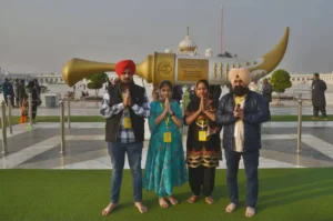 Large group of Sikh pilgrims gathered at Gurdwara Janam Asthan for a major religious ceremony.