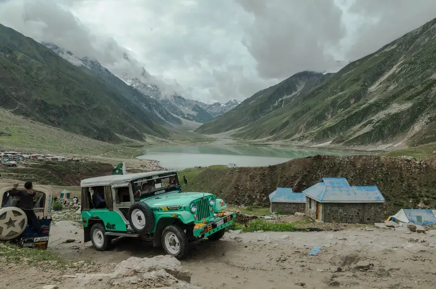 Tourists riding jeeps to reach Saiful Muluk Lake – a stunning alpine lake at the northern end of Kaghan Valley, Pakistan