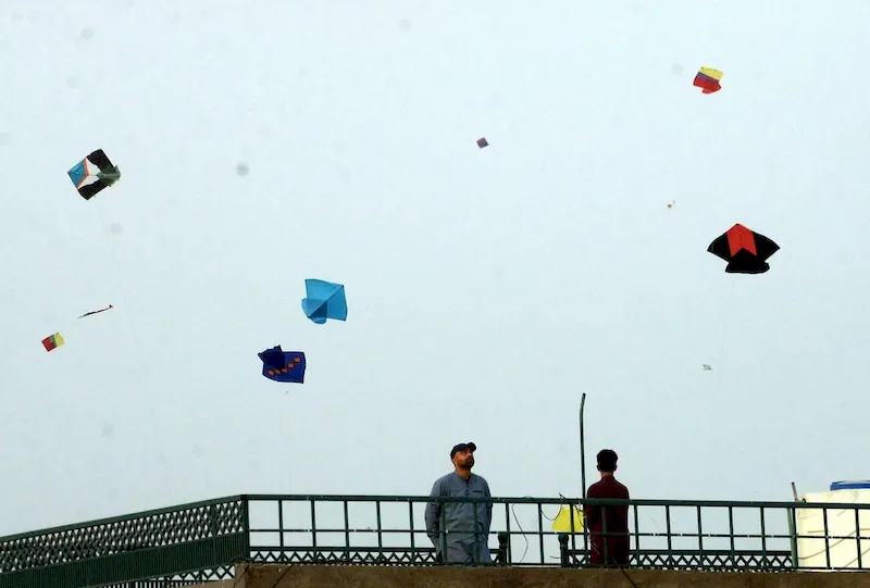 Vibrant Basant Festival in Pakistan as joyful youths fly colorful kites against a clear February sky, welcoming the spring season with traditional celebration and energy that captivates tourists.