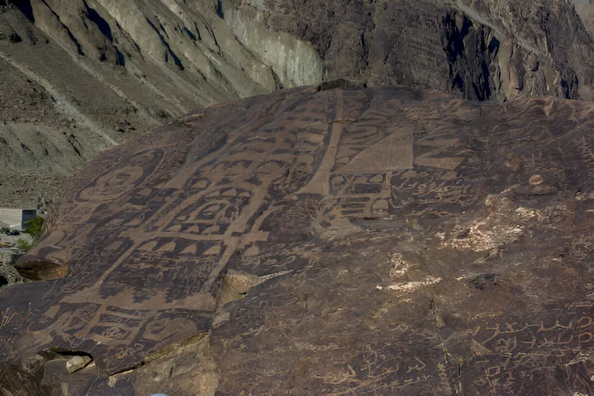 Ancient Chilas petroglyphs carved into rocks along the Karakoram Highway in Gilgit-Baltistan, Pakistan."