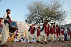 Artists from Pakistan’s five provinces performing traditional dances in colorful dresses during the “Sanwal Mor Mohara” festival organized by Punjab Arts Council and DG Khan.