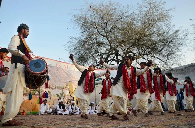Artists from Pakistan’s five provinces performing traditional dances in colorful dresses during the “Sanwal Mor Mohara” festival organized by Punjab Arts Council and DG Khan.