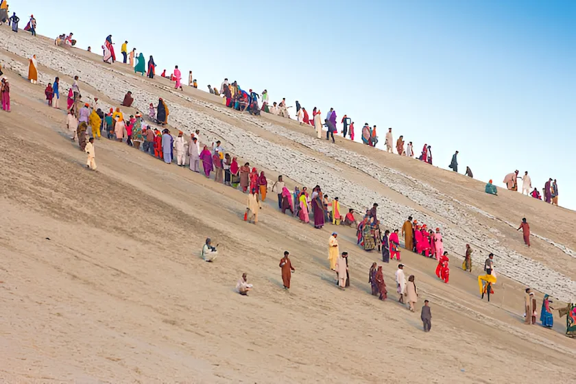 Hinglaj Yatra pilgrims ascending Chandarkhup mountain to perform sacred Hindu rituals during the annual pilgrimage in Balochistan.