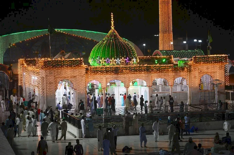 A stunning night view of the illuminated shrine of Sufi Saint Syed Ali bin Osman Al-Hajvery, widely revered as Data Ganj Bakhsh, in Lahore, Pakistan.