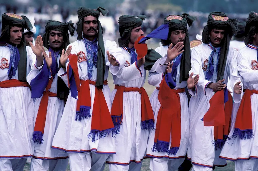 n in traditional Balochi attire at the vibrant Sibi Mela cattle fair in Balochistan, Pakistan—celebrating heritage, livestock trading, and local culture in a colorful annual event.