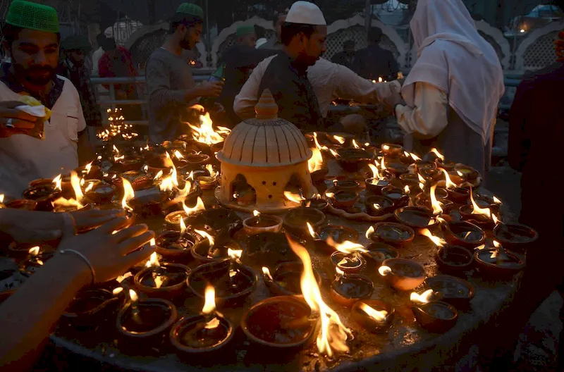 Pakistani devotees gathered at the shrine of Sufi Saint Syed Ali bin Usman Al-Hajvery to participate in religious rituals during the 974th Urs celebrations, reflecting spiritual devotion and cultural heritage.