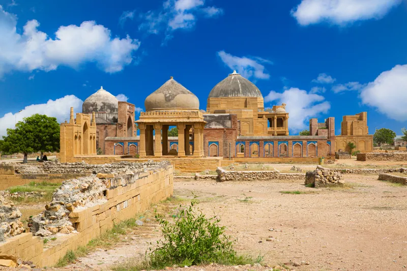 Makli Necropolis in Thatta Sindh with tombs and cloudy sky